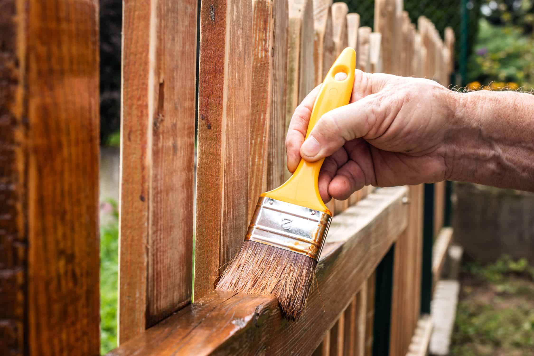 Painting picket fence by wood stain wood fence maintenance