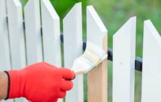 priming wood fence before painting